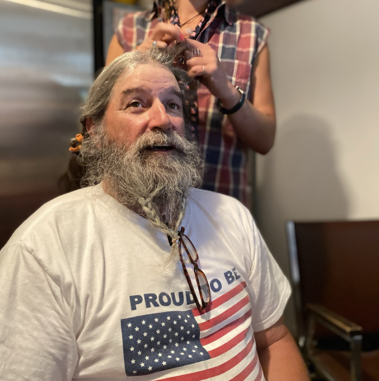 Whitewater rafting guide and all things Wyoming River Trips enthusiast getting a river guide hairstyle special for the 4th of July in Cody Wyoming